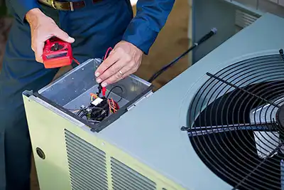 One of our service techs working on a outside AC unit in florida